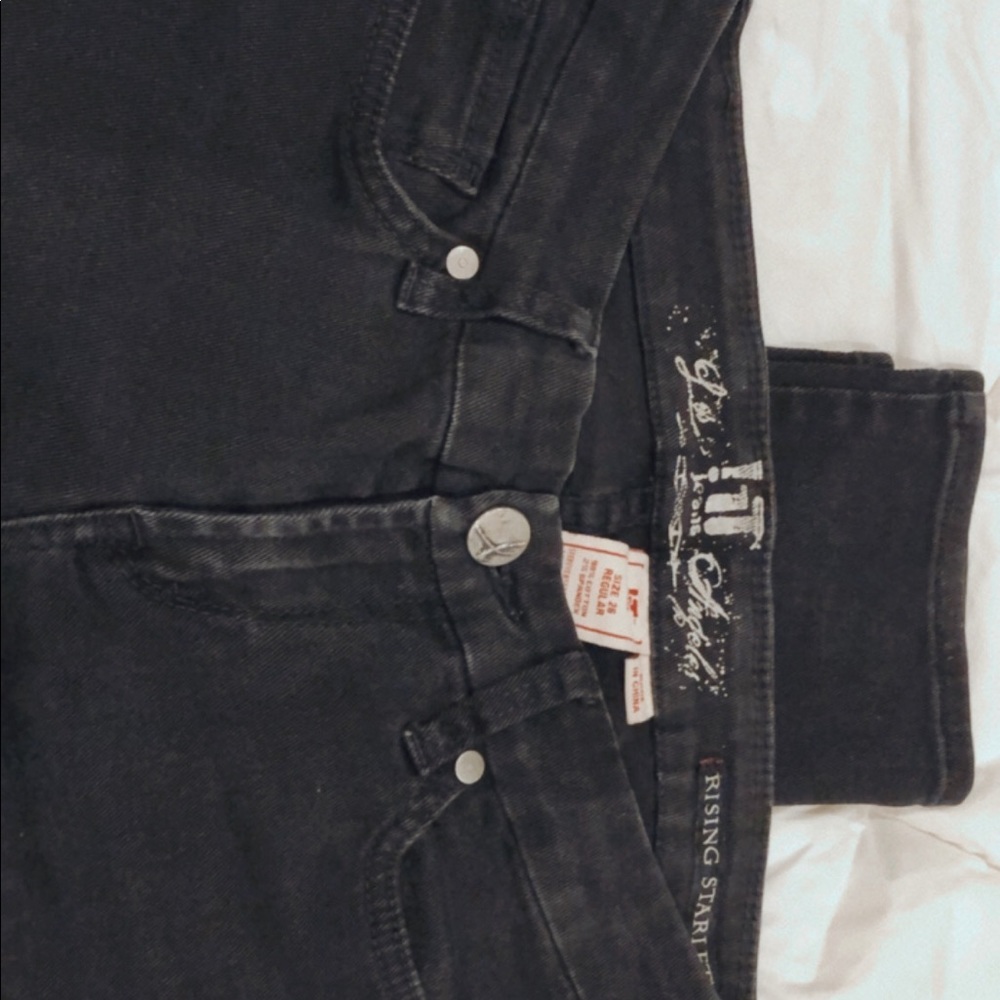 Washed out black jeans.